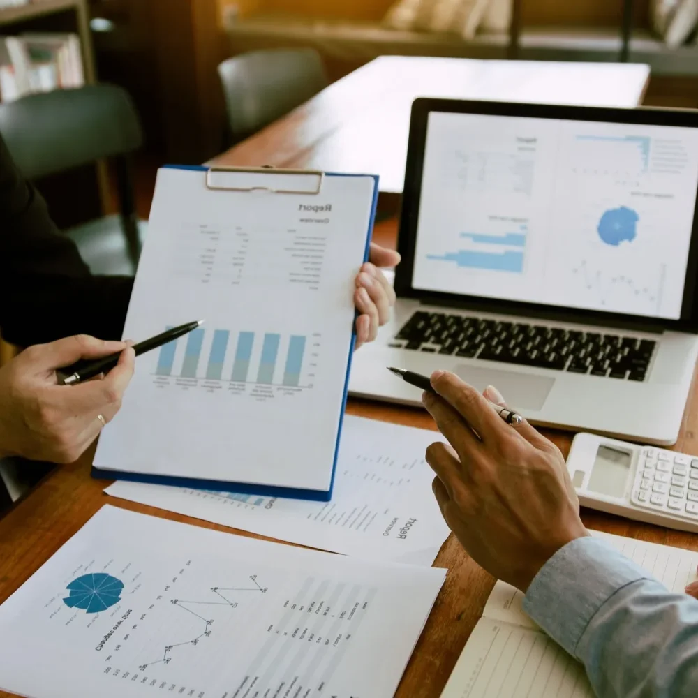 two-business-partnership-coworkers-analysis-strategy-with-discussing-a-financial-planning-graph-and